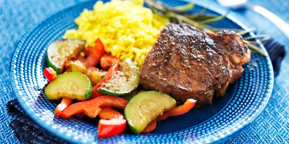 steak with vegetables and rice dinner